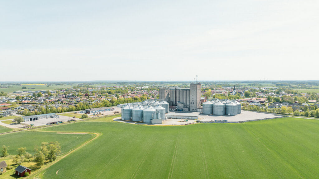 Silos and a field of grass.
